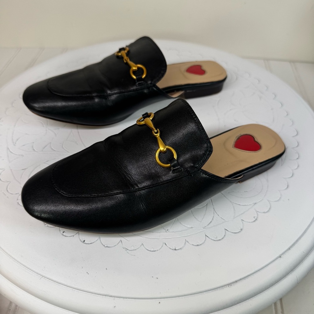 ARQA black leather almond toe mules